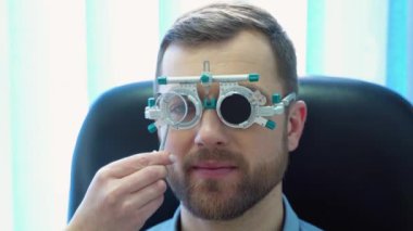 A handsome male patient wearing special ophthalmic glasses