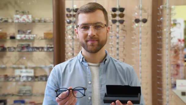 Handsome Young Man Holds Case Glasses Optics — Stock video