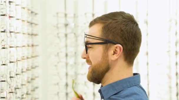 Portrait Funny Male Client Several Glasses Showcase Eyewear — Stockvideo
