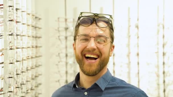 Portrait Funny Male Client Several Glasses Showcase Eyewear — Vídeos de Stock
