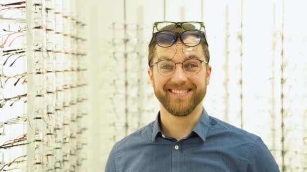 Portrait Funny Male Client Several Glasses Showcase Eyewear — Video Stock