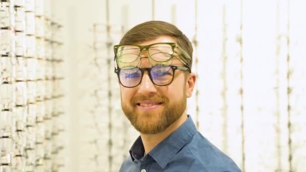 Portrait Funny Male Client Several Glasses Showcase Eyewear — Video Stock