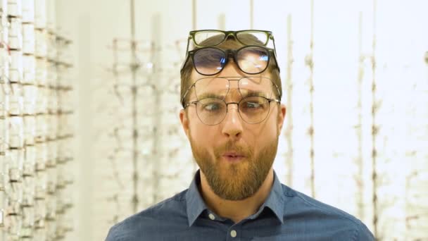 Portrait Funny Male Client Several Glasses Showcase Eyewear — Vídeos de Stock