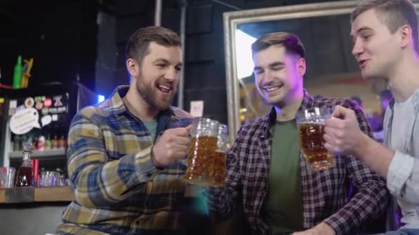 Group Happy Young Men Drinking Cold Draft Beer Chatting Having — Stockvideo