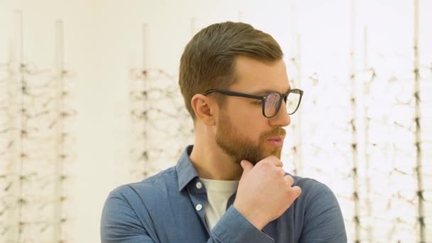 Conceived Man Choosing Glasses Optics Store Health Care Eyesight Vision — Vídeo de Stock