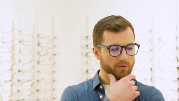 Conceived Man Choosing Glasses Optics Store Health Care Eyesight Vision — ストック動画