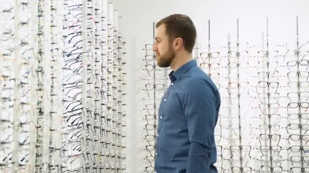 Health Care Eyesight Vision Concept Man Choosing Glasses Optics Store — 图库视频影像