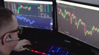 Crypto trader investor analyst broker using pc computer analyzing digital cryptocurrency exchange stock market trading graphs report thinking of investing funds risks doing global analysis.
