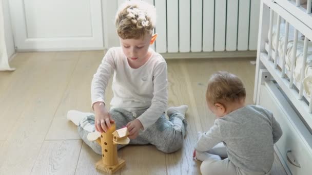 Preschool Boy Girl Playing Floor Wooden Toys Children Toddlers Home — Vídeo de Stock