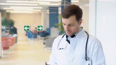 Male doctor invites for treatment in a modern clinic