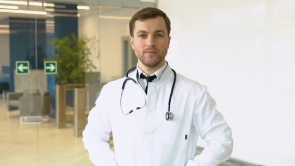 Smiling Young Caucasian Male Doctor White Medical Uniform Show Good — Vídeos de Stock