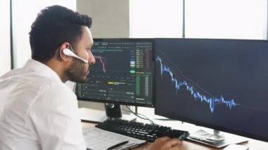 Indian business man trader investor analyst looking at financial stock market charts rate dynamic, trading data indexes growth using pc for cryptocurrency digital analytics