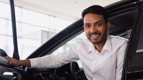 Happy Successful Indian Man Sitting His New Car Auto Showroom — Stok Video