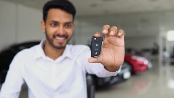 Positive Male Smiling Camera Demonstrating Keys While Standing New Vehicle — Stok Video