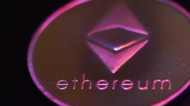 Macro shot of Ethereum coin. Silver Ethereum, crypto currency. Digital exchange, popularity of eth, symbol of future money.