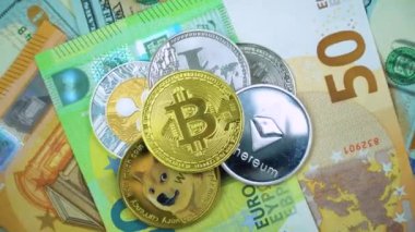 Bitcoin BTC, Ethereum ETH, Ripple XRP, Litecoin LTC, Dogecoin DOGE coins are rotating on bills of 50 and 100 euro