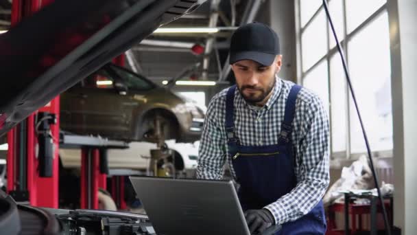Experienced Mechanic Uniform Using Laptop While Repairing Car Auto Service — Stock Video