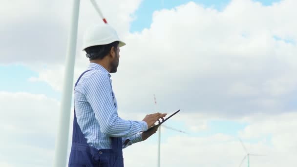 Indian Worker Checks Wind Turbine System Tablet Alternative Energy Wind — Stock Video