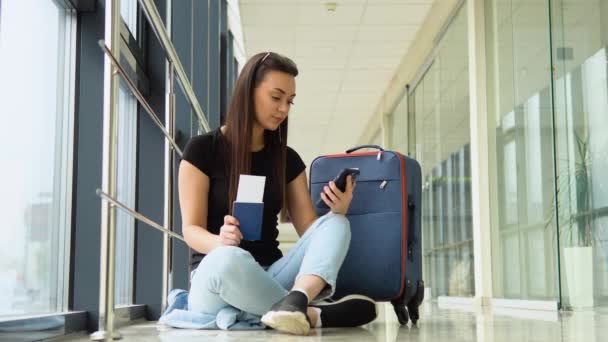Young Woman Using Smartphone Airport Lobby — Stock Video