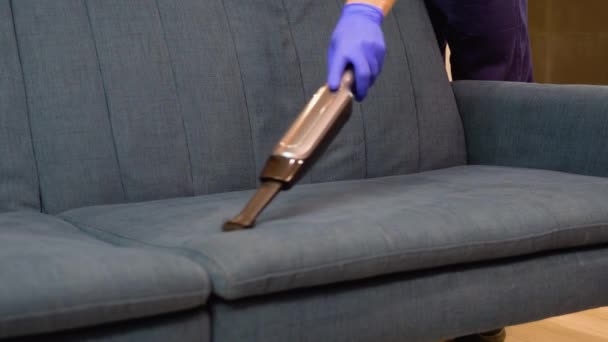 Young Male Worker Cleaning Sofa Vacuum Cleaner — Stock Video
