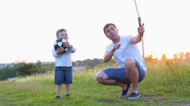 Father Teaching Son Use Bow Arrow — Stock Video