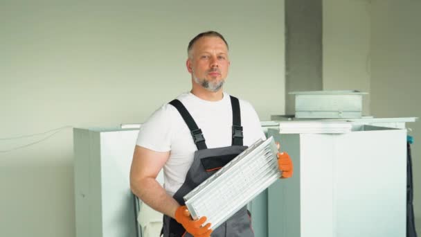Worker Holding Air Filter Installing Commercial Building Office Ventilation System — Stock Video