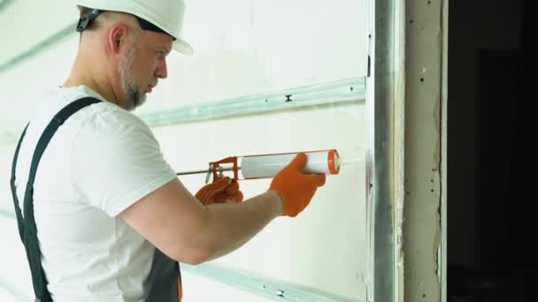 Worker Uniform Applying Polyurethane Foam Fill Gap Drywall Wall — Stock Video