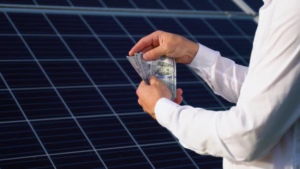 Saving Money Sun Energy Solar Panels Hand Dollars — Vídeos de Stock