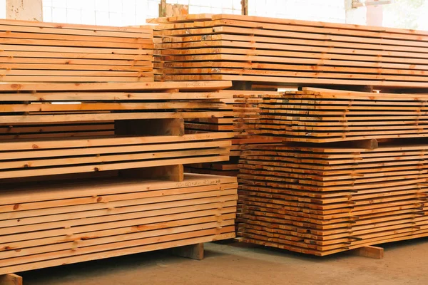 Wooden boards, lumber, industrial wood, timber. Pine wood timber.