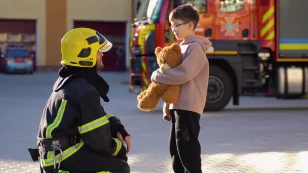 Little Boy Toy Firefighter Protective Uniform Fire Station — Stock Video