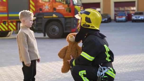Fireman Gives Toy Rescued Child — Stock Video