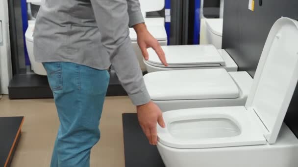 Man Choosing Bathroom Toilet Bowl Utensils His Home — Stock Video