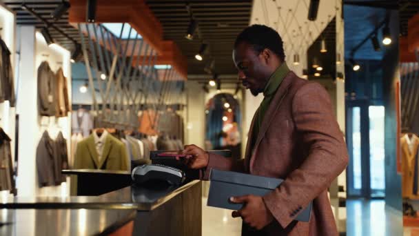 Black Man Buys Shoes Paying Contactless Nfc Smartphone Touching Terminal — Stock Video