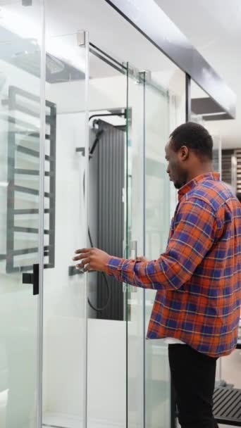 Black Man Choosing Shower Cabin His Home Bathroom — Stock Video