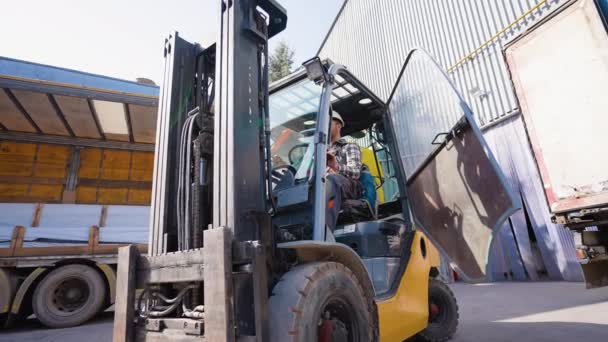 Male Forklift Driver Working Loading Unloading Goods Storehouse — Stock Video