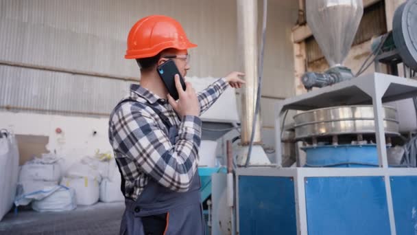 Worker Pvc Windows Factory Speaks Phone Production Line — Stock Video