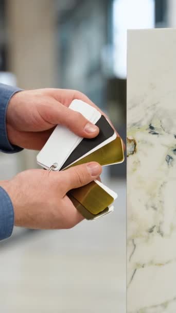 Male Hands Choosing Metal Decor Fugue Compare Ceramic Tile — Stock Video