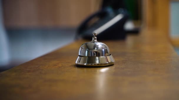 Woman Ringing Hotel Service Bell Wooden Reception Desk Closeup — Stockvideo