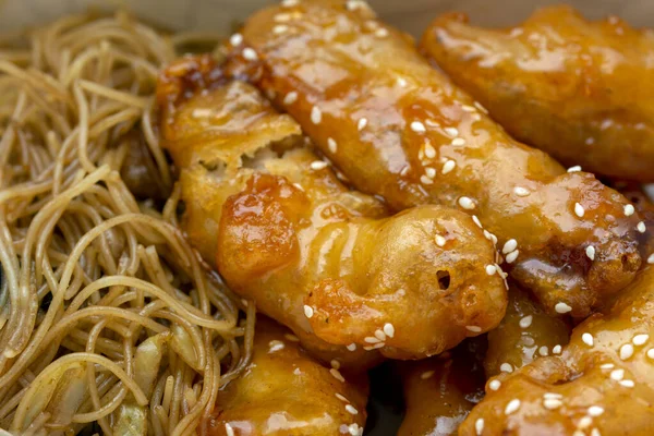 Chicken Meat Dipped Orange Sauce Crust Noodles Garnish — Stock Photo, Image