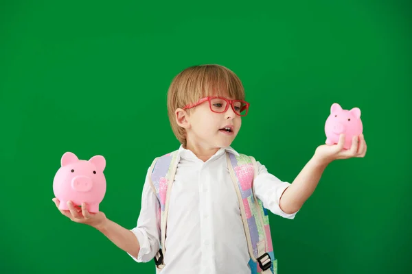 Funny Child Student Holding Piggybank Class Happy Kid Green Chalkboard — Stock Photo, Image