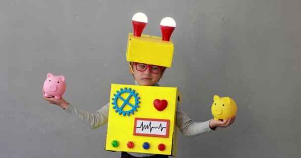 Happy Child Wearing Toy Robot Funny Kid Holding Piggybanks Success — Vídeo de Stock