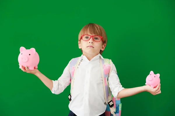 Funny Child Student Holding Piggybank Class Happy Kid Green Chalkboard — Stock Photo, Image