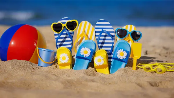 Family Flip Flops Beach Ball Snorkel Yellow Sand Blue Sea Royalty Free Stock Photos