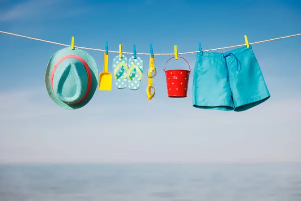 Beach Hat Flip Flops Goggles Hanging Clothesline Things Vacation Blue Royalty Free Stock Images