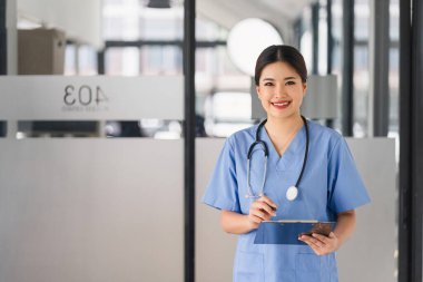 Portrait of healthcare professional holding medical lab patient health check form at hospital