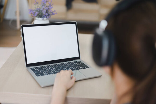 Person Using Laptop with Blank Screen. White screen for graphic montage
