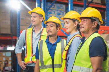 Portrait of successful logistics warehouse workers team, Group portrait of industry workers, Workers in hardhat helmet at workplace