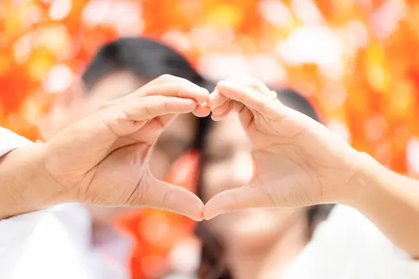 Close-up of Couple hands making heart shape, Hand making heart sign, Person holding hands