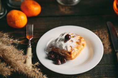 Homemade pastries on beautifully served table decorated in rustic style. Cozy home, tea time, food background