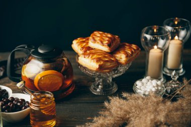 Homemade pastries on beautifully served table decorated in rustic style. Cozy home, tea time, food background
